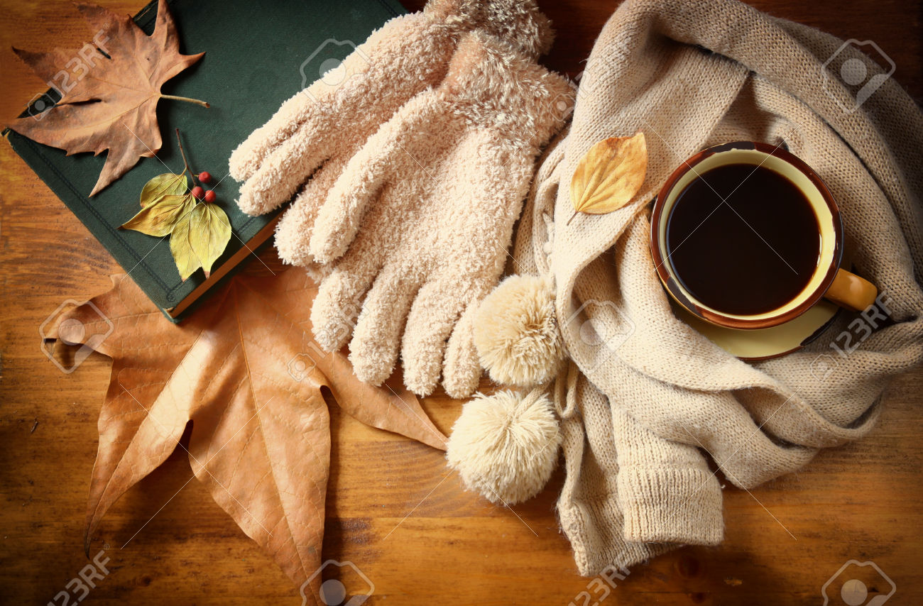 33649496-top-view-of-cup-of-black-coffee-with-autumn-leaves-a-warm-scarf-stock-photo.jpg